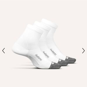 2 pairs of white Feetures Elite Quarter socks